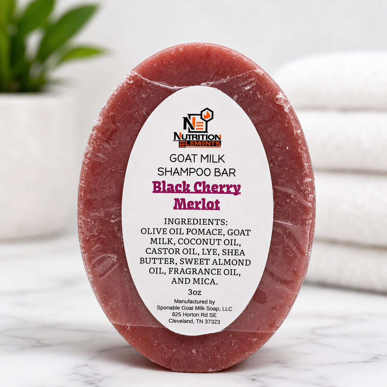 Goat milk shampoo bar with 'Black Cherry Merlot' flavor on a white background