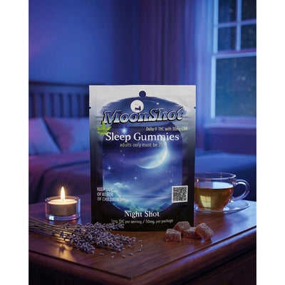 MoonShot Sleep Gummies packaging on a nightstand with tea and lavender