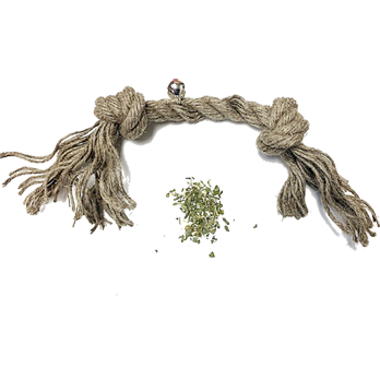 Rope toy with tassels and a small pile of green catnip on a white background