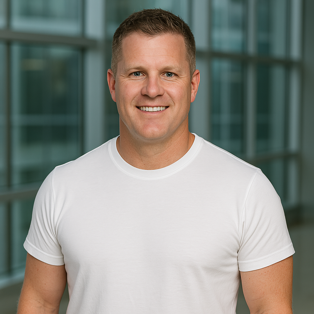 Evan, owner of Nutrition Elements, smiling in a white shirt